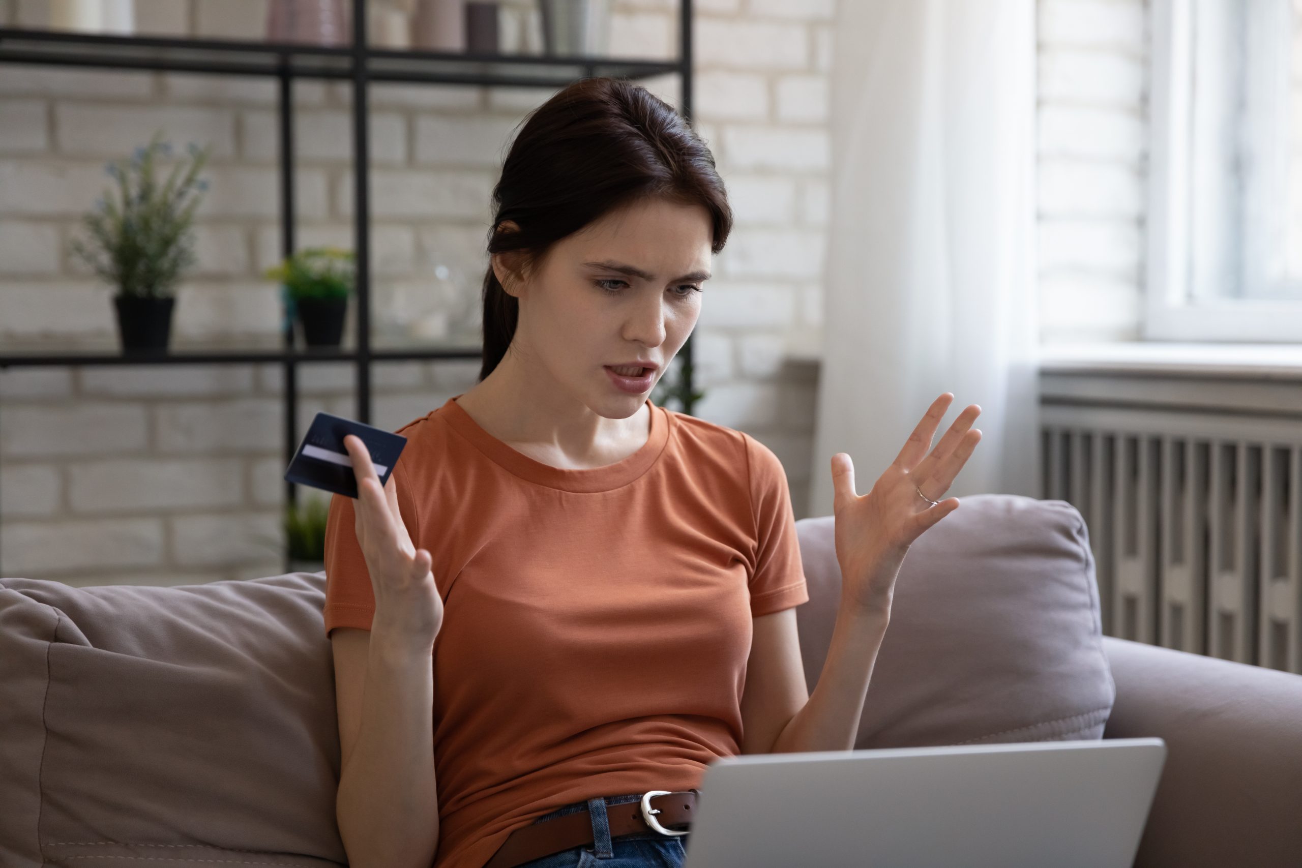 Young woman being defrauded online
